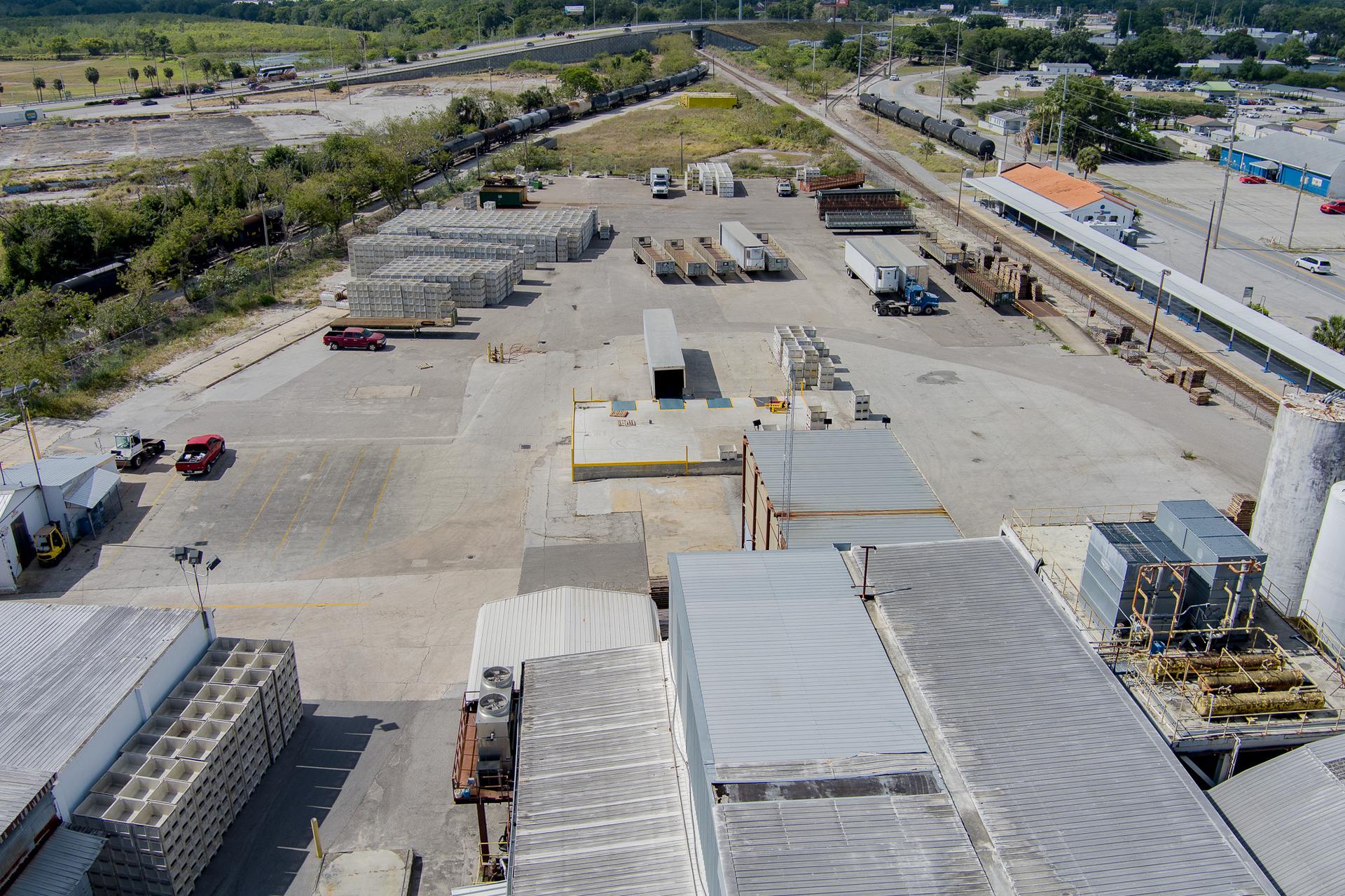The full Winter Haven yard with trucks and trailers parked