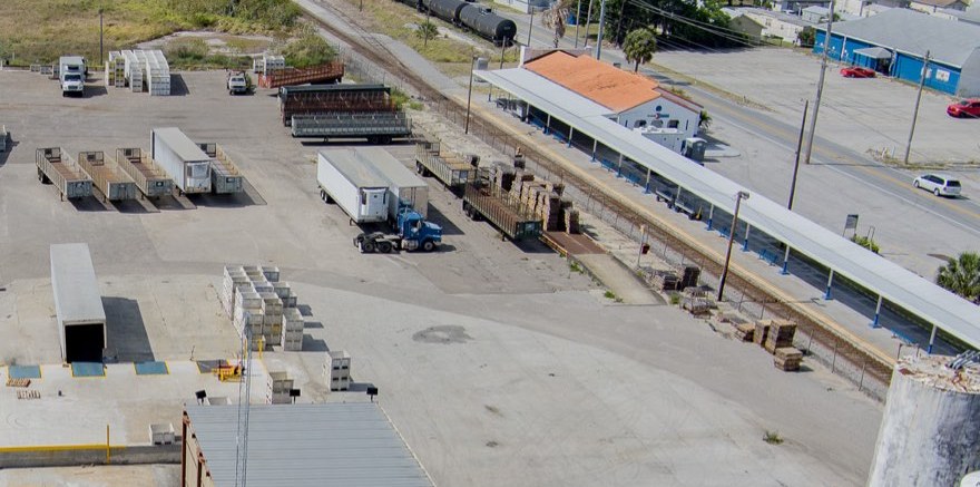 Semi truck and trailers inside the Winter Haven yard